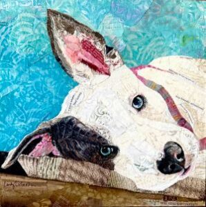 pet portrait of a white dog with a black patch