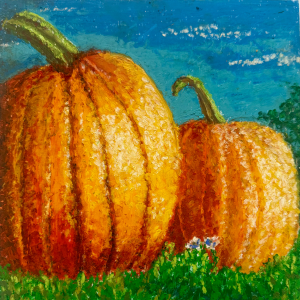 2 large pumpkins and a blue sky